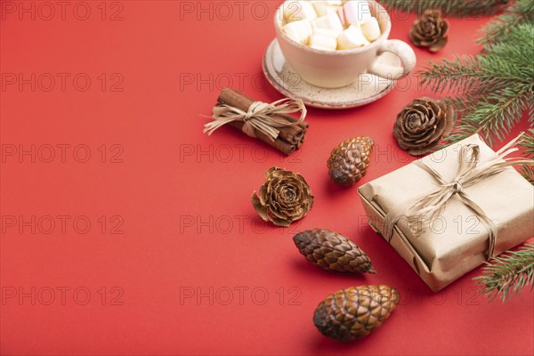 Christmas or New Year composition. Decorations, box, cinnamon, cones, fir and spruce branches, cup