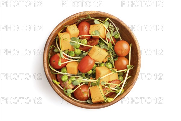 Vegetarian vegetable salad of tomatoes, pumpkin, microgreen pea sprouts isolated on white