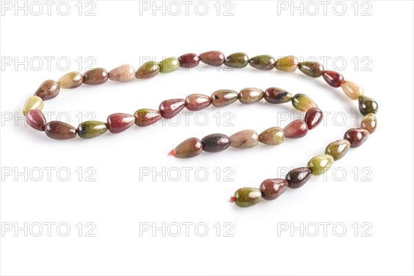 Colored onyx beads isolated on white background. top view, close up