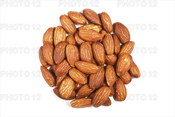 Pile of sweet almond nut isolated on white background. Top view