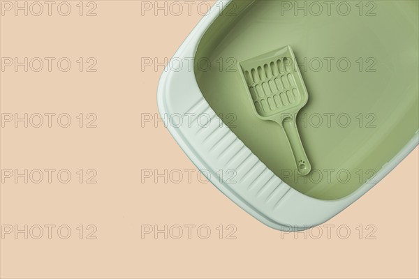 Cat toilet, cat tray, empty, clean, new. with a scoop, top view, pistachio color