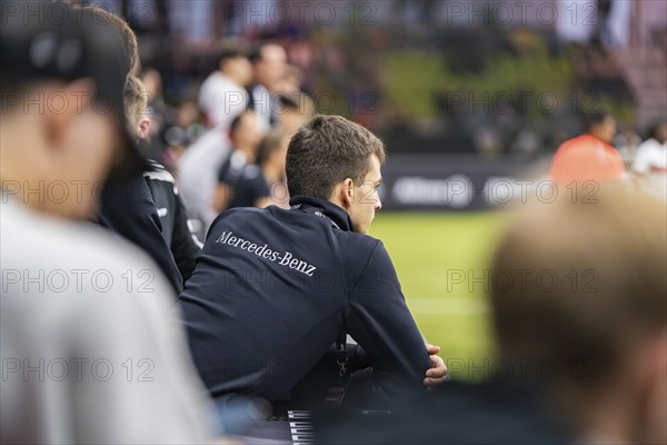 A coach watches the action on the pitch intently, Mercedes Benz Junior Cup, Glaspalast