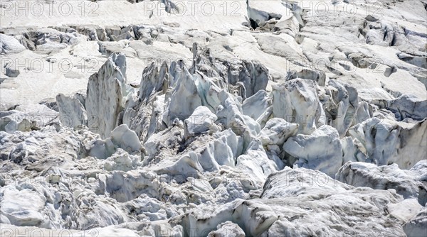 Rutted glacier ice with crevasses, high alpine mountain landscape, La Jonction, Chamonix,