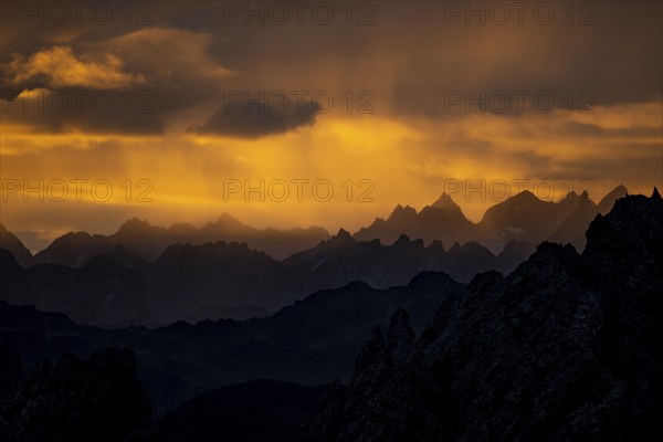 Montafon mountains with dramatic cloudy sky at sunrise, Tschagguns, Rätikon, Montafon, Vorarlberg,