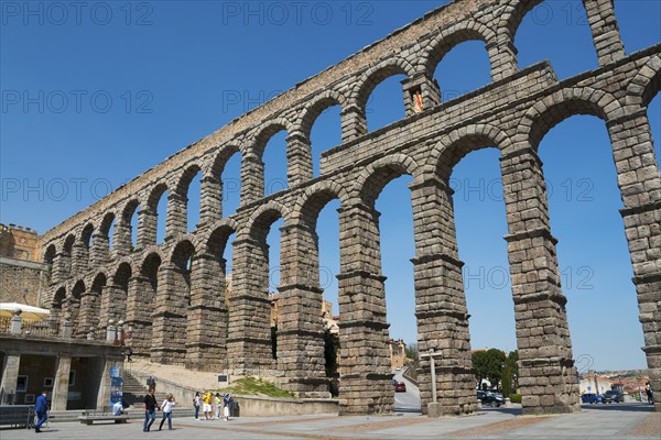 Ancient stone aqueduct in impressive architecture under a blue sky, Aqueduct, Segovia, Castilla y