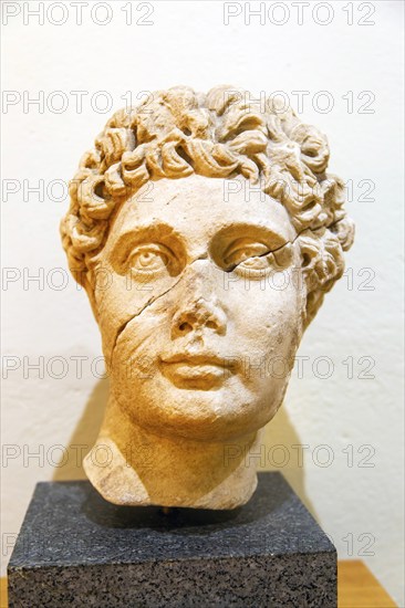 Carved marble Roman portrait head of a young man, archaeology museum, Apollonia Archaeological