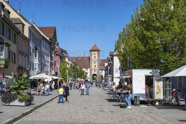 Pedestrian zone, shopping street with the Obertor, historic town gate of Villingen,