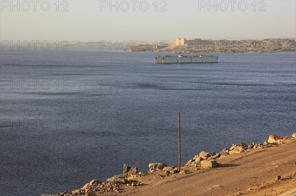 View from the dam across the Nile to the Temple of Isis at Philae on the island of Agilkia, Africa,