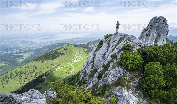 Climber on a climbing tour, climber on a mountain ridge, alpine climbing, crossing the Kampenwand,