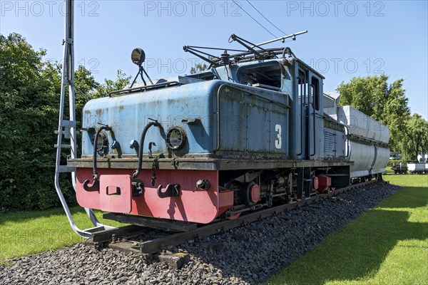 Vintage electric locomotive no. 3 from Krupp AEG with coal wagon for transporting lignite in