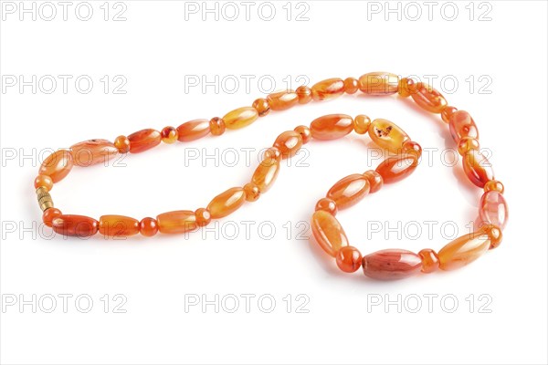 Colored onyx beads isolated on white background. top view, close up