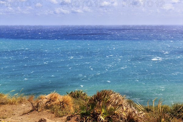 View of turquoise sea, horizon, coastline at La Isleta, sunny weather, typical light mood,