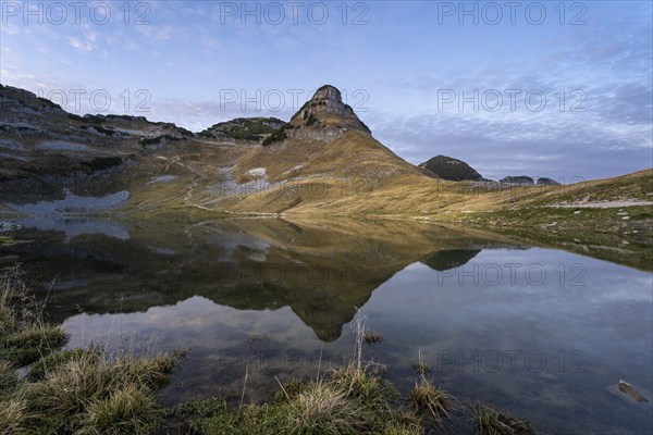 Lake Augstsee and the Atterkogel mountain on the Loser. Autumn, good weather, blue sky. In the