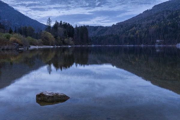 Lake Schwarzensee in autumn. Trees in autumn leaves. Blue hour. Reflection. St. Wolfgang,