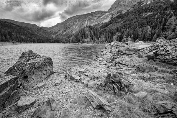 Obernberger See, mountain lake, landscape of the Stubai Alps, weather mood, cloud mood, black and