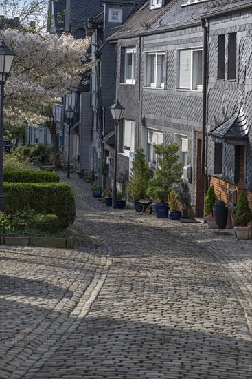 Cobbled old town alleyway with historic slate houses, Siegen, North Rhine-Westphalia, Germany,