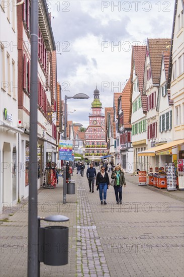 A lively pedestrian zone with half-timbered houses and people strolling along the street, Kirchheim