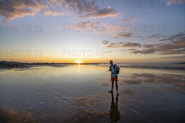 Evening mood, man at low tide on the beach, Marino Ballena National Park, Puntarenas Province, Osa,