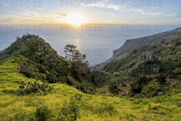 Evening mood, green coastal landscape on a steep cliff, sea and coast, viewpoint Miradouro da