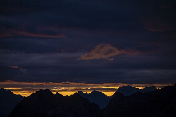 Montafon mountains with dramatic cloudy sky at sunrise, Tschagguns, Rätikon, Montafon, Vorarlberg,