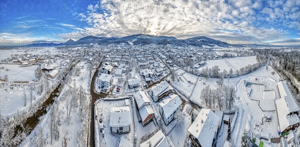 Panorama of a snow-covered village from a bird's eye view under a blue sky, Bad Feilnbach