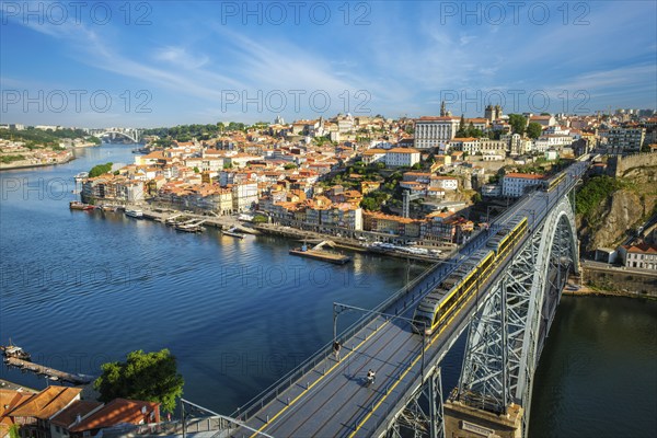 View of Porto city and Douro river and Dom Luis bridge I with metro tram from famous tourist