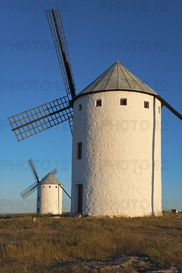 Large windmill in the sunlight with another one in the background, Campo de Criptana, Ciudad Real