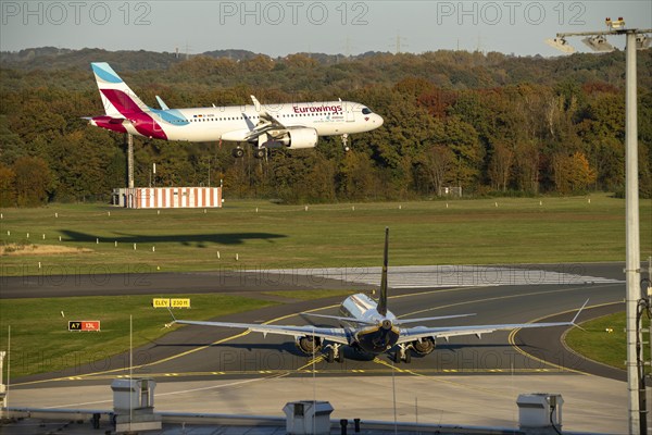 Eurowings Airbus A320neo landing at Cologne-Bonn Airport, Ryanair Boeing 737, waiting on the