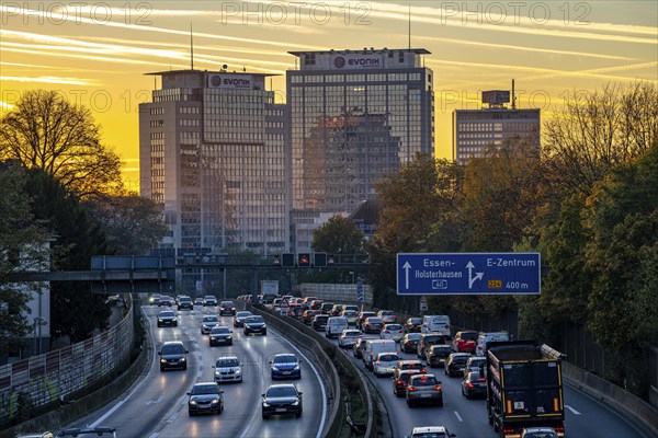 Evening traffic, partly with traffic jams, slow-moving traffic on the A40 motorway, Essen skyline,