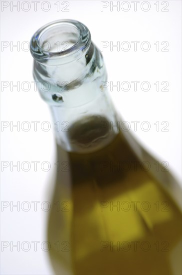 Bottle with olive oil in detail