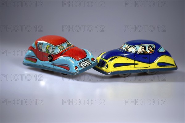 Road traffic, automobile, collision, depicted with model cars made of tin, old, old, tin toy,