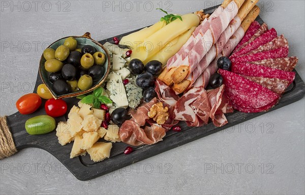Appetizer, assortment, set, sausage, and cheese, on a wooden board, top view, no people