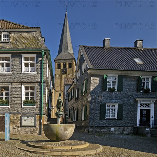 Historic upper town with horse fountain and church tower of St. Lambertus, Mettmann, Bergisches