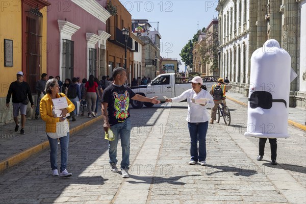 Oaxaca, Mexico, Health workers walk the streets handing out free condoms as part of their fight