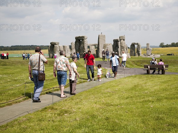 Large numbers of tourists visiting the World Heritage neolithic site of standing stones at