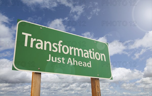 Transformation just ahead green road sign over clouds and blue sky, AI generated