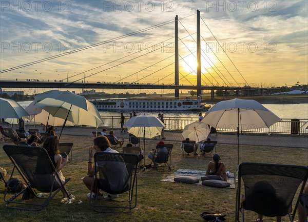 The city beach on the Rhine near Düsseldorf, riverside promenade, by the Rheinkniebrücke bridge,