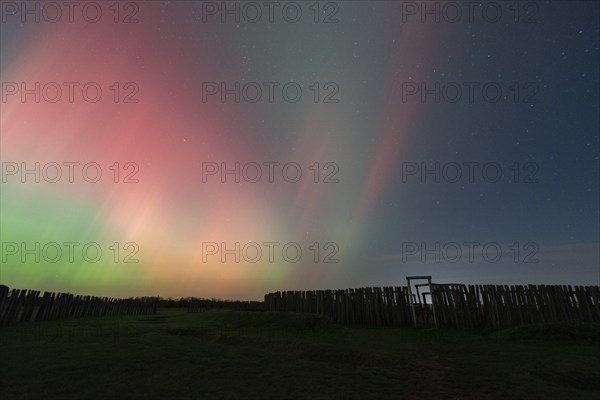 Northern lights (aurora borealis) over the ring sanctuary of Pömmelte, prehistoric circular ditch