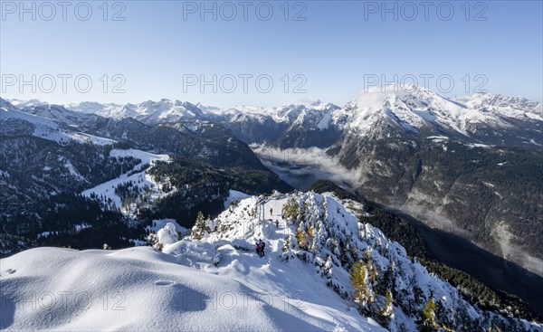 Snow-covered summit of the Jenner with viewing platform in autumn, view of the sea of clouds and