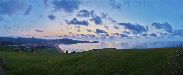 Sunset at the Atlantic coast in summer on the way to Zarautz at the Camino del Norte, coastal path,