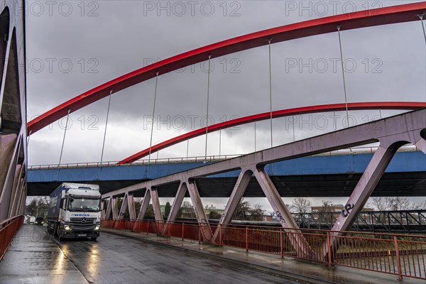 Dilapidated A42 motorway bridge (red arches) over the Rhine-Herne Canal, with massive structural
