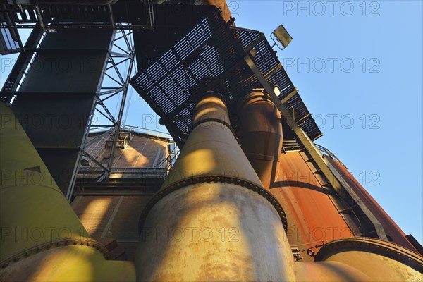 Metal industrial plant with old pipes and steel structures showing traces of rust, Landschaftspark