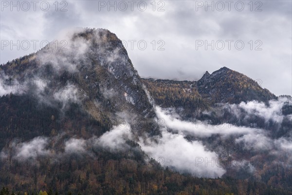 View of part of the Tennengebirge from Oberscheffau. The mountains are covered in clouds. Autumn.