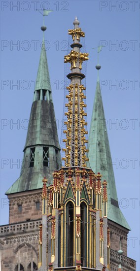 Spire of the Beautiful Fountain, behind the towers of St Sebald's Church, Main Market Square,