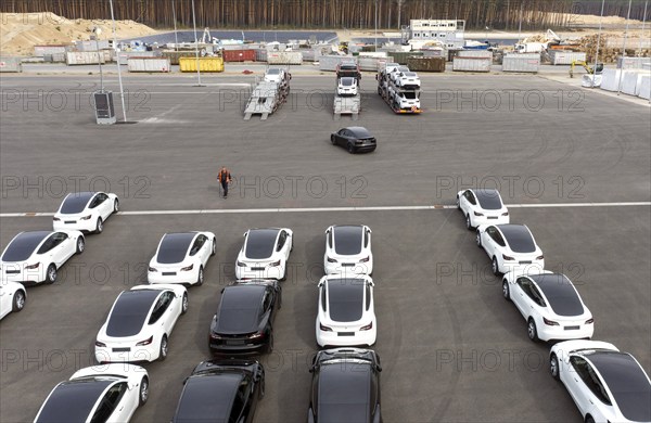 Tesla Y models produced in the Tesla Giga Factory are loaded onto car transporters, Grünheide, 24