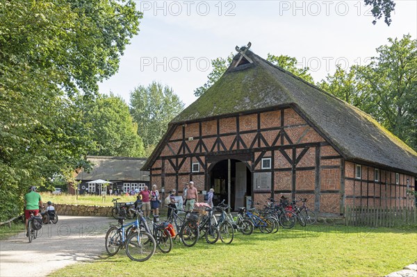 Heidemuseum Dat ole Huus, Low German hall house, people, bicycles, Wilsede, Bispingen, Lüneburg