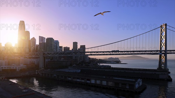 Panoramic San Francisco financial district skyline in city downtown with Oakland Bay Bridge