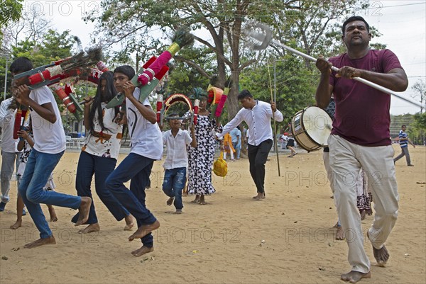 Sri Lankan pilgrims dancing in the Buddhist temple Ruhunu Maha Kataragama Dewalaya, Kataragama, Uva