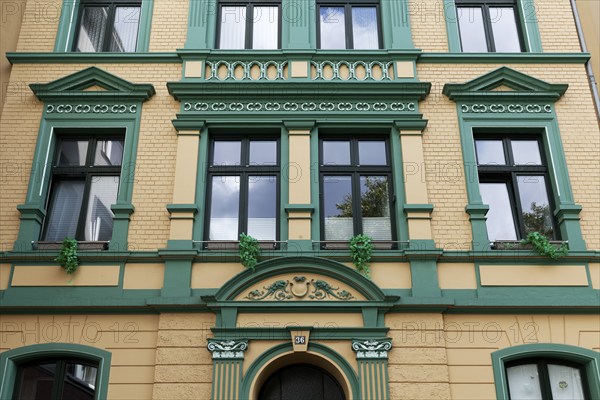 Renovated residential building in Wilhelminian style, decorative façade, old building property,