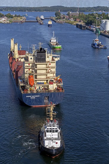 Cargo ship waiting in front of the lock, tugboat, Kiel Canal, Holtenau, Kiel, Schleswig-Holstein,